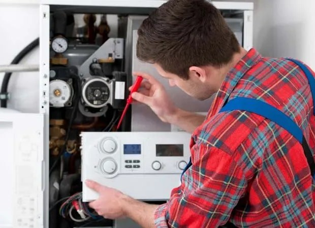 Certified HVAC specialist troubleshooting a furnace in Las Vegas Nevada