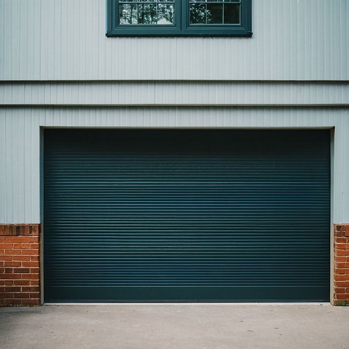 Repairing damaged garage door tracks at a residential property